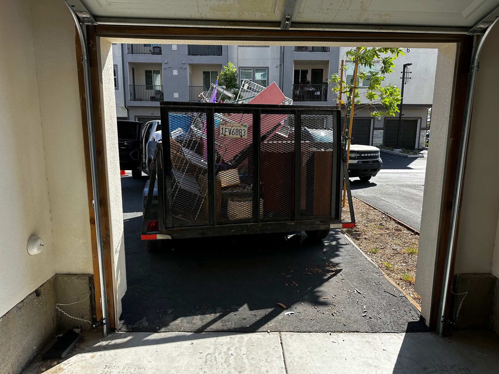 Garage cleanout with the trailer loaded full of furniture and junk
